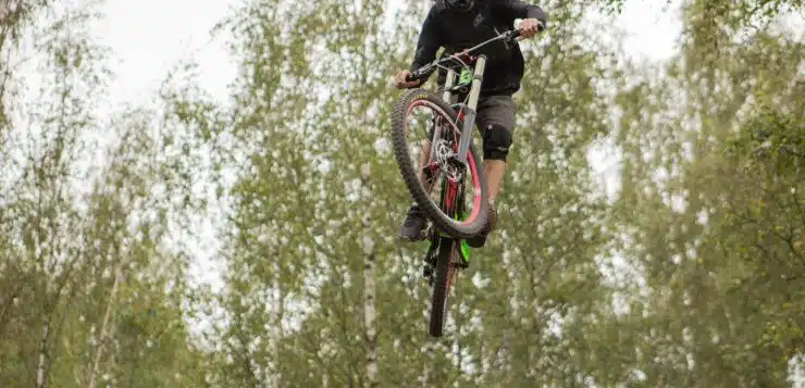 a man riding a bike up in the air