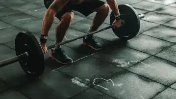 man holding dumbbells