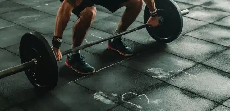 man holding dumbbells